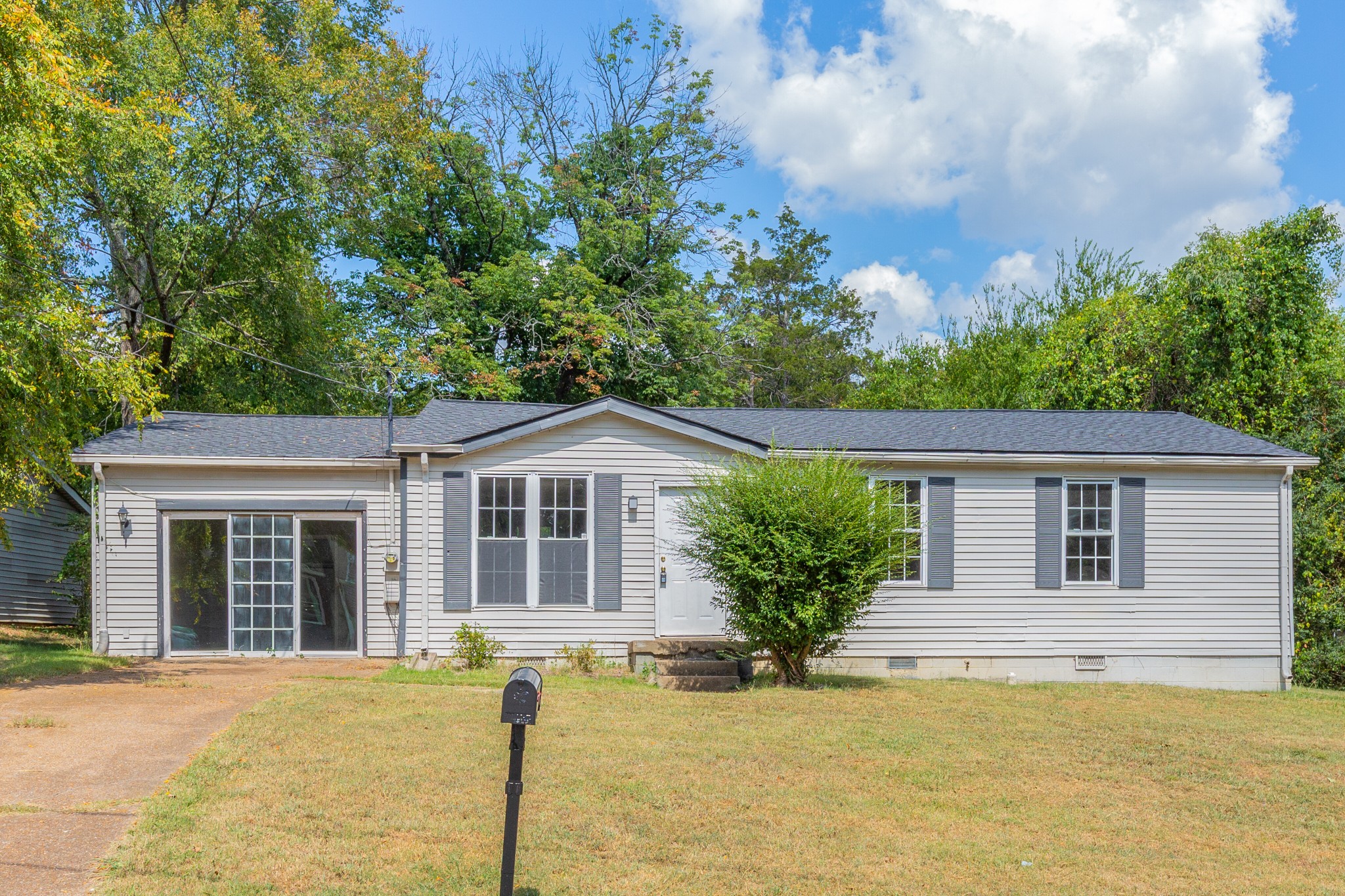 229 Manzano Road Madison, TN 37115 - Photo 1 of 26 front view of a house with a yard