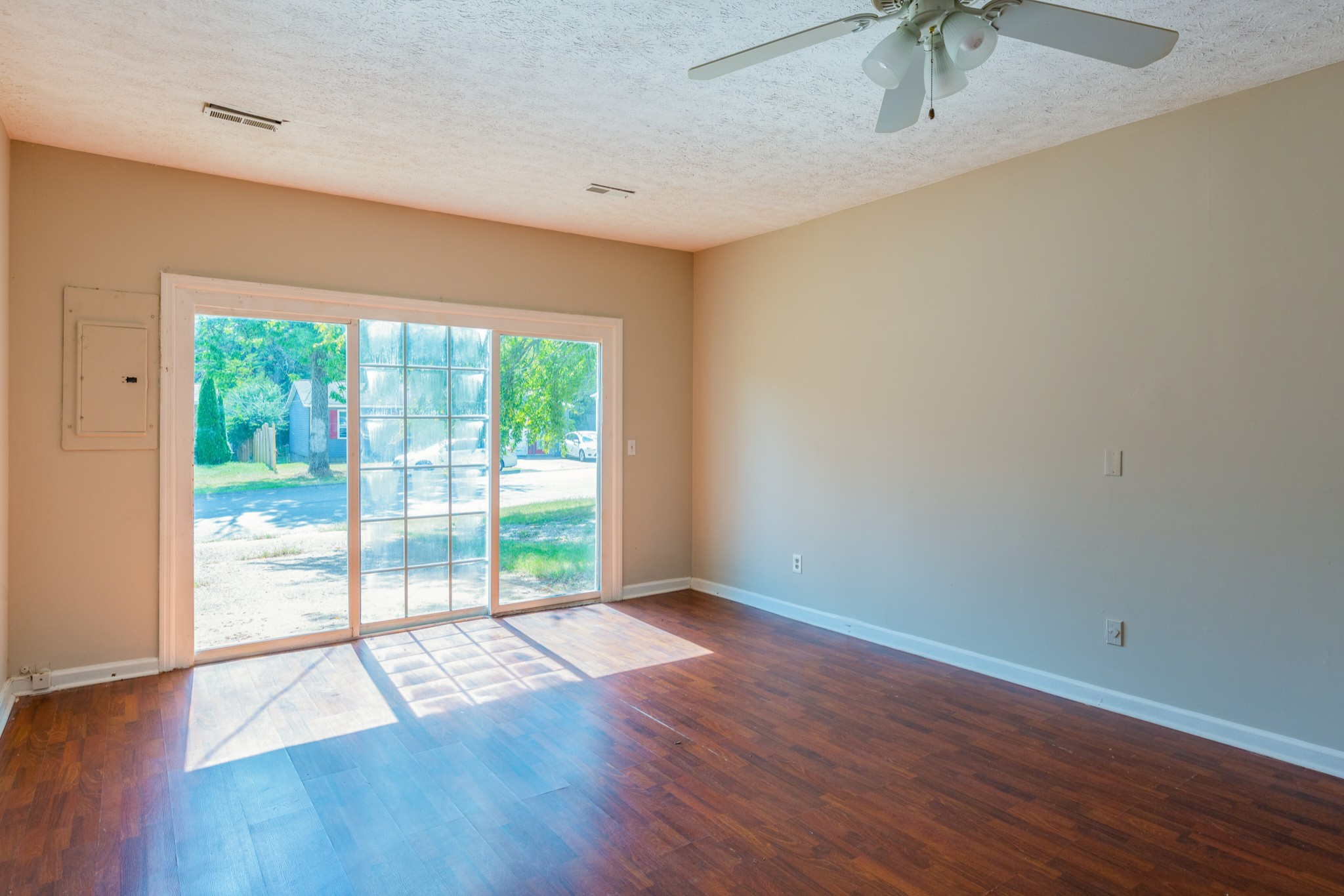 229 Manzano Road Madison, TN 37115 - Photo 12 of 26 wooden floor in an empty room with a window