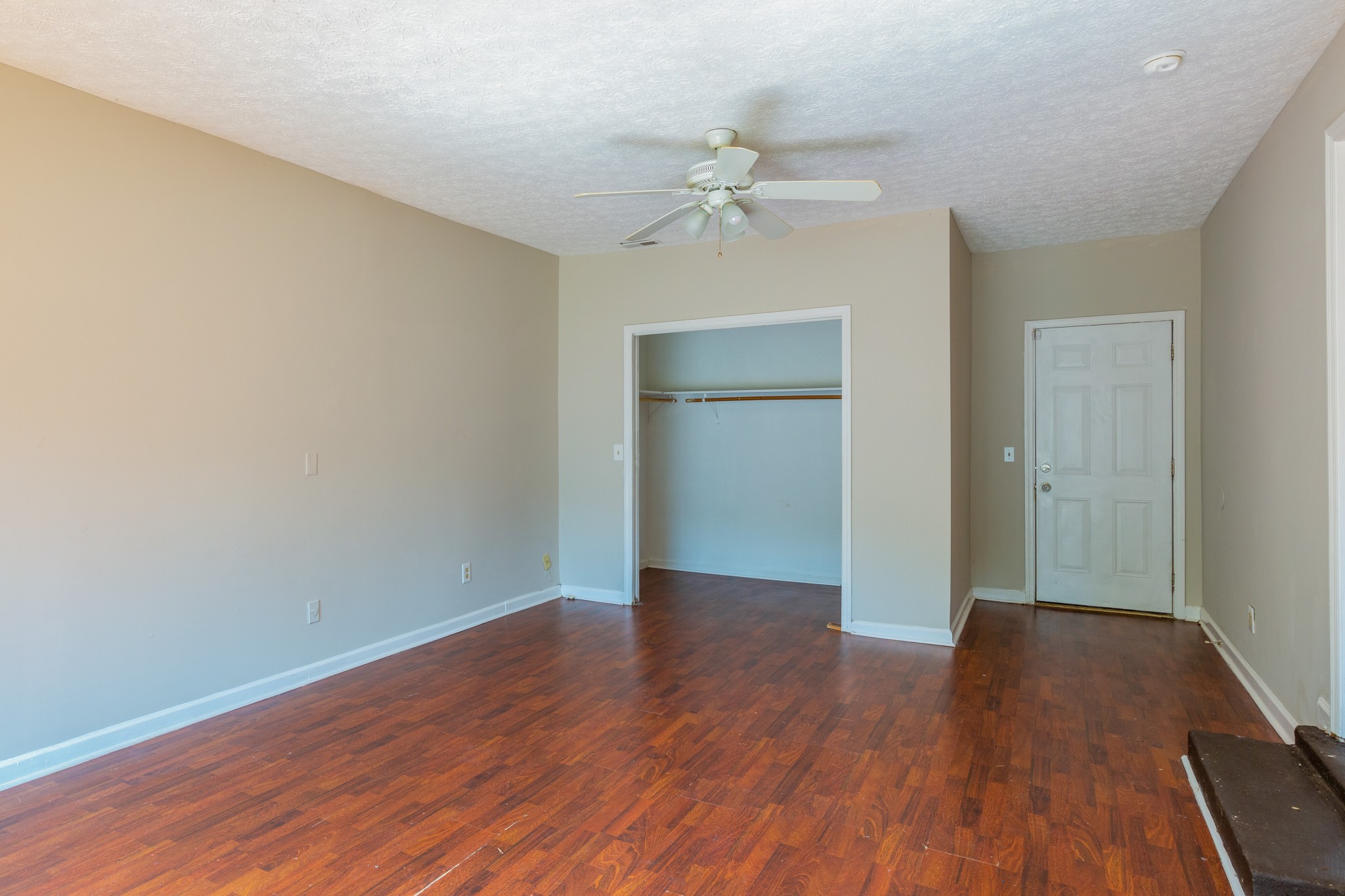 229 Manzano Road Madison, TN 37115 - Photo 13 of 26 a view of an empty room with wooden floor