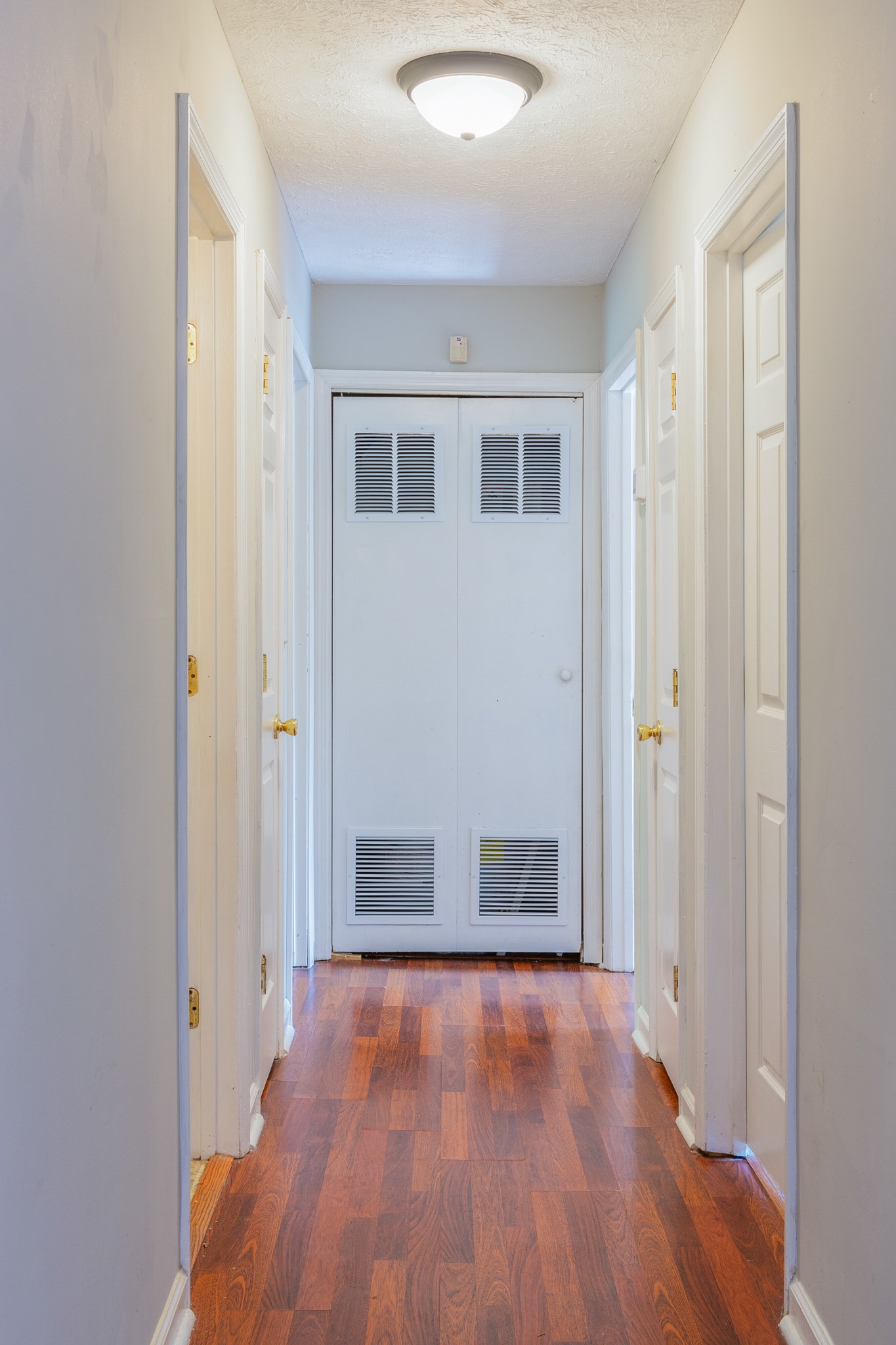 229 Manzano Road Madison, TN 37115 - Photo 17 of 26 an empty room with wooden floor and windows