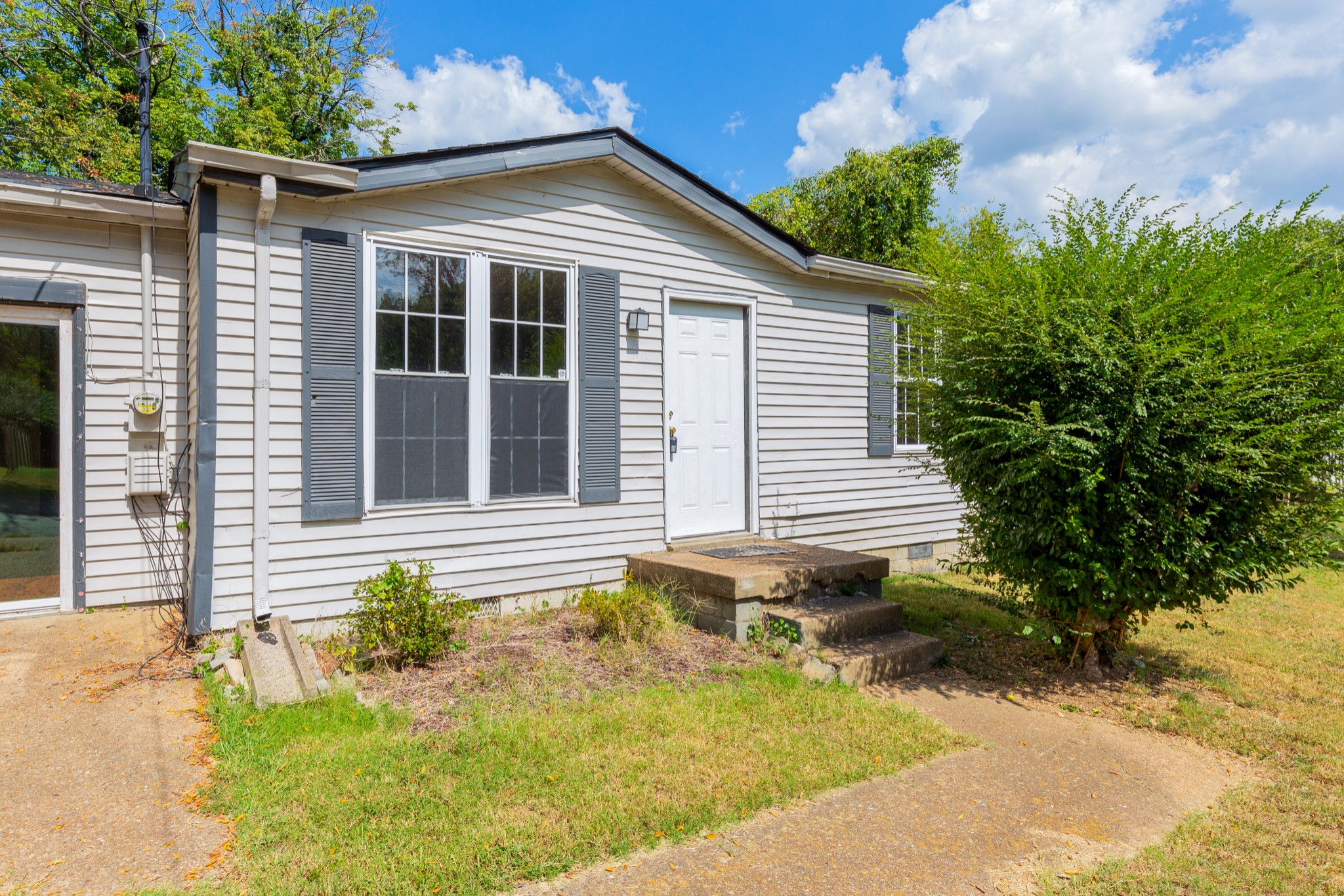 229 Manzano Road Madison, TN 37115 - Photo 4 of 26 a front view of a house with a yard