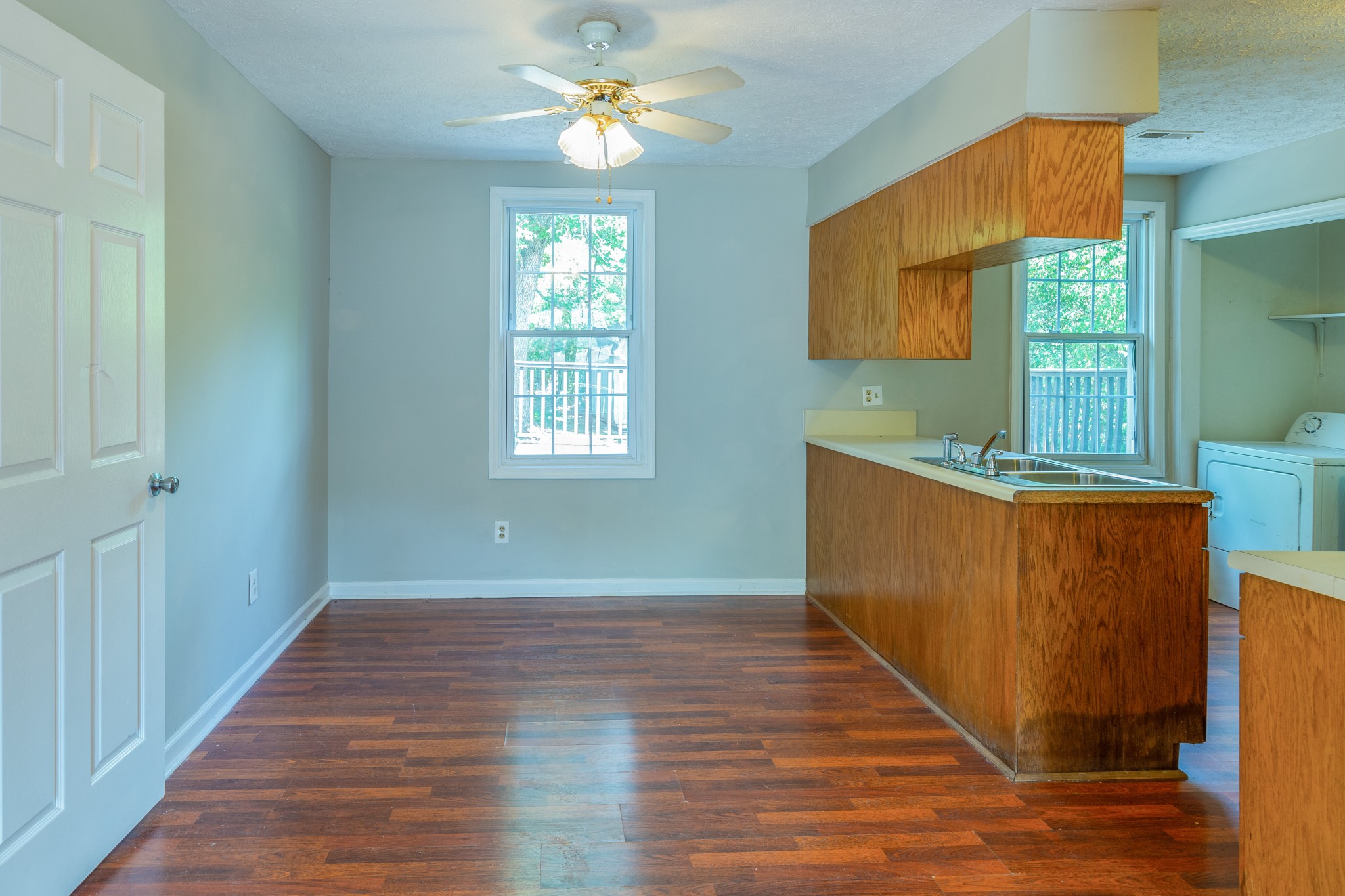 229 Manzano Road Madison, TN 37115 - Photo 8 of 26 a view of an empty room with a window and wooden floor