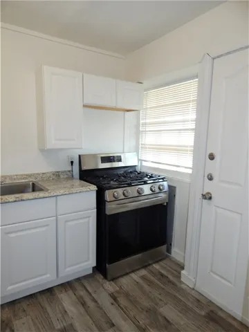 a kitchen with a stove and a sink