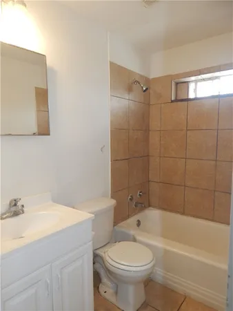 a bathroom with a sink toilet and bathtub