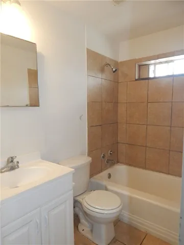 a bathroom with a sink toilet and bathtub