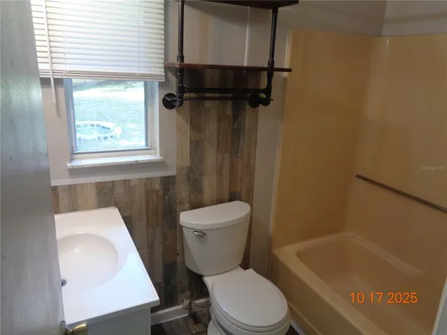 a kitchen with stainless steel appliances a refrigerator and a stove