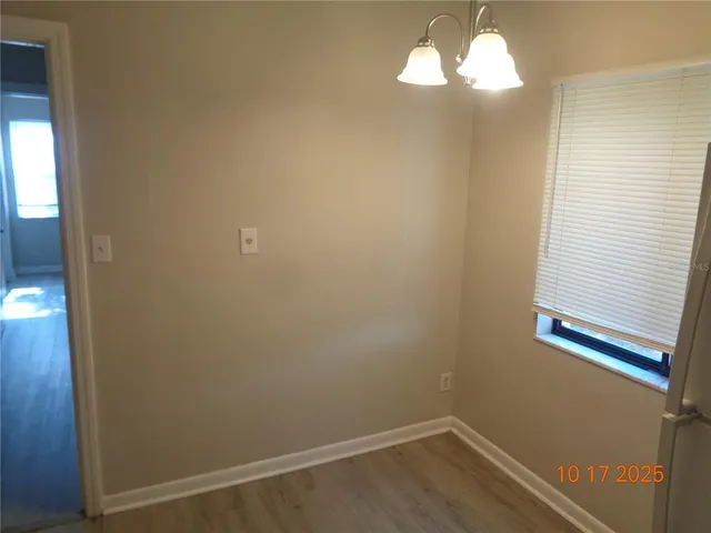 a kitchen with a sink a stove and cabinets