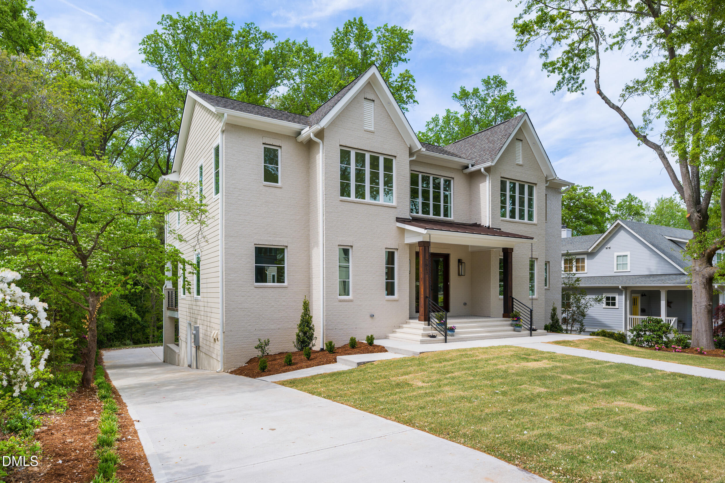 2817 Claremont Road Raleigh, NC 27608 - Photo 2 of 73 a front view of a house with a garden