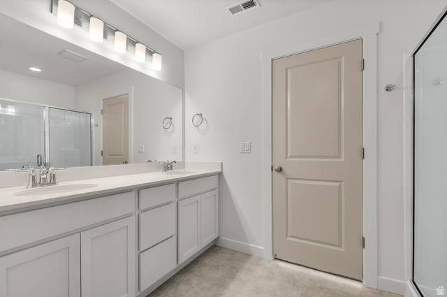 7797 West Alta Springs Way Magna, UT 84044 - Photo 16 of 21 Full bath with a shower stall and double vanity