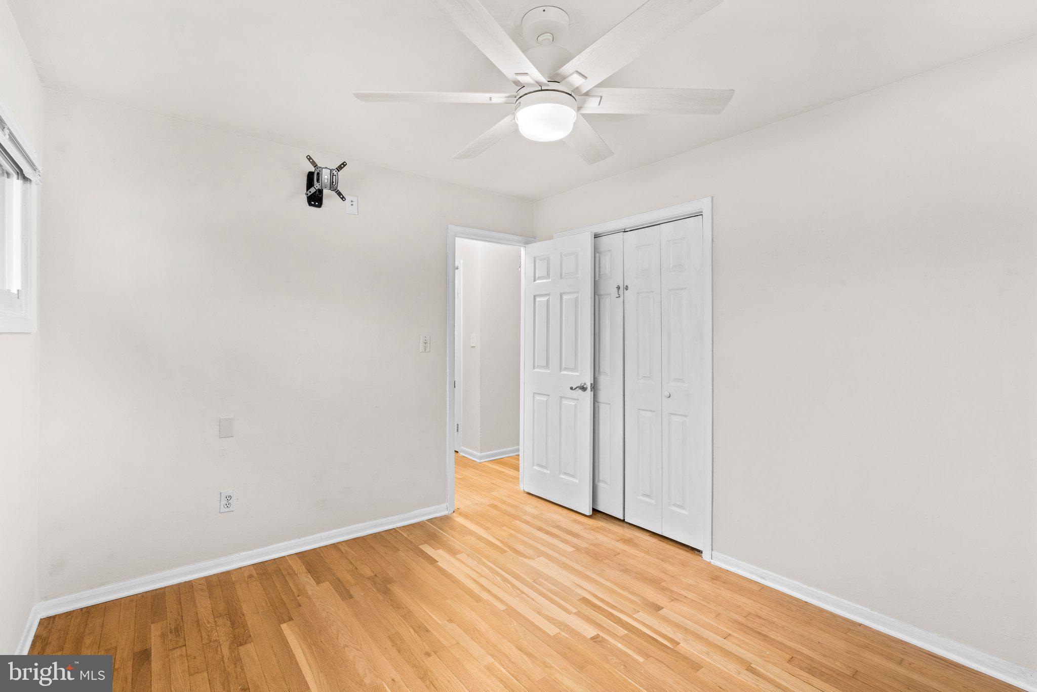 1020 Collwood Road Catonsville, MD 21228 - Photo 16 of 38 a view of a big room with closet and a ceiling fan