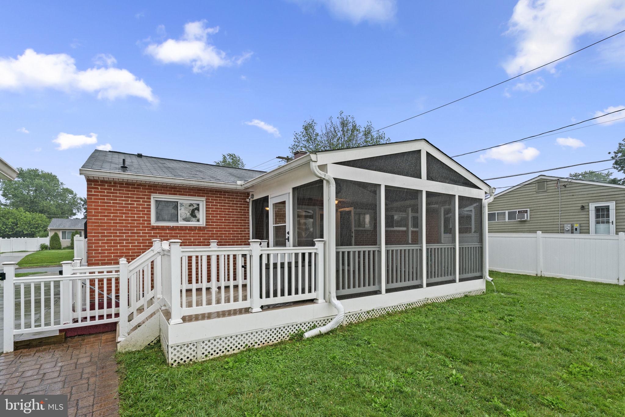 1020 Collwood Road Catonsville, MD 21228 - Photo 35 of 38 a view of a house with yard and deck