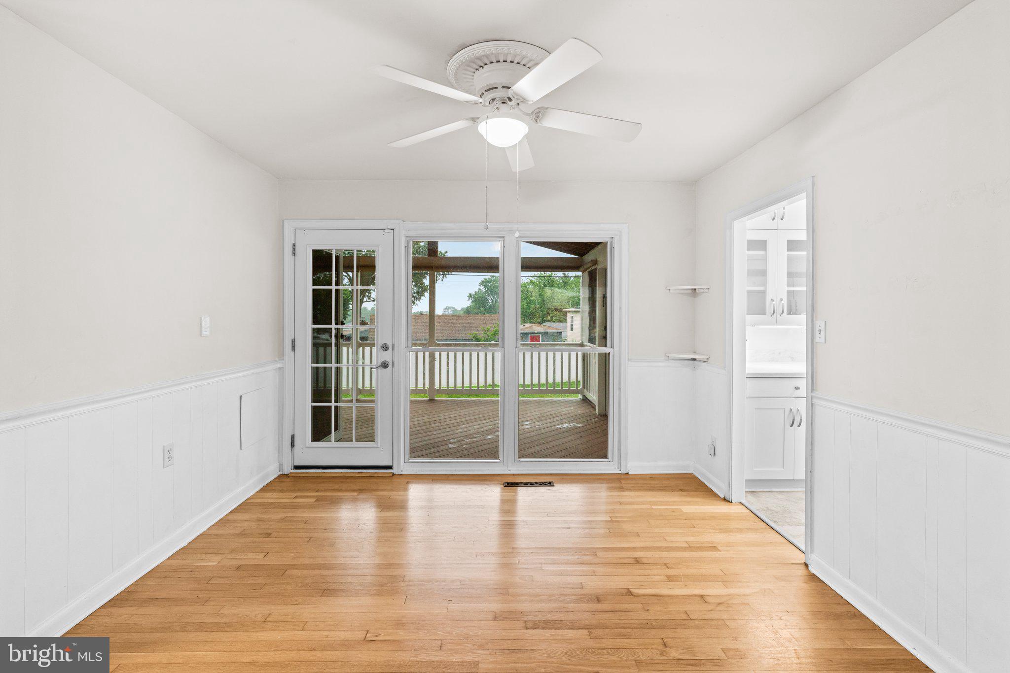 1020 Collwood Road Catonsville, MD 21228 - Photo 8 of 38 wooden floor in an empty room with a window