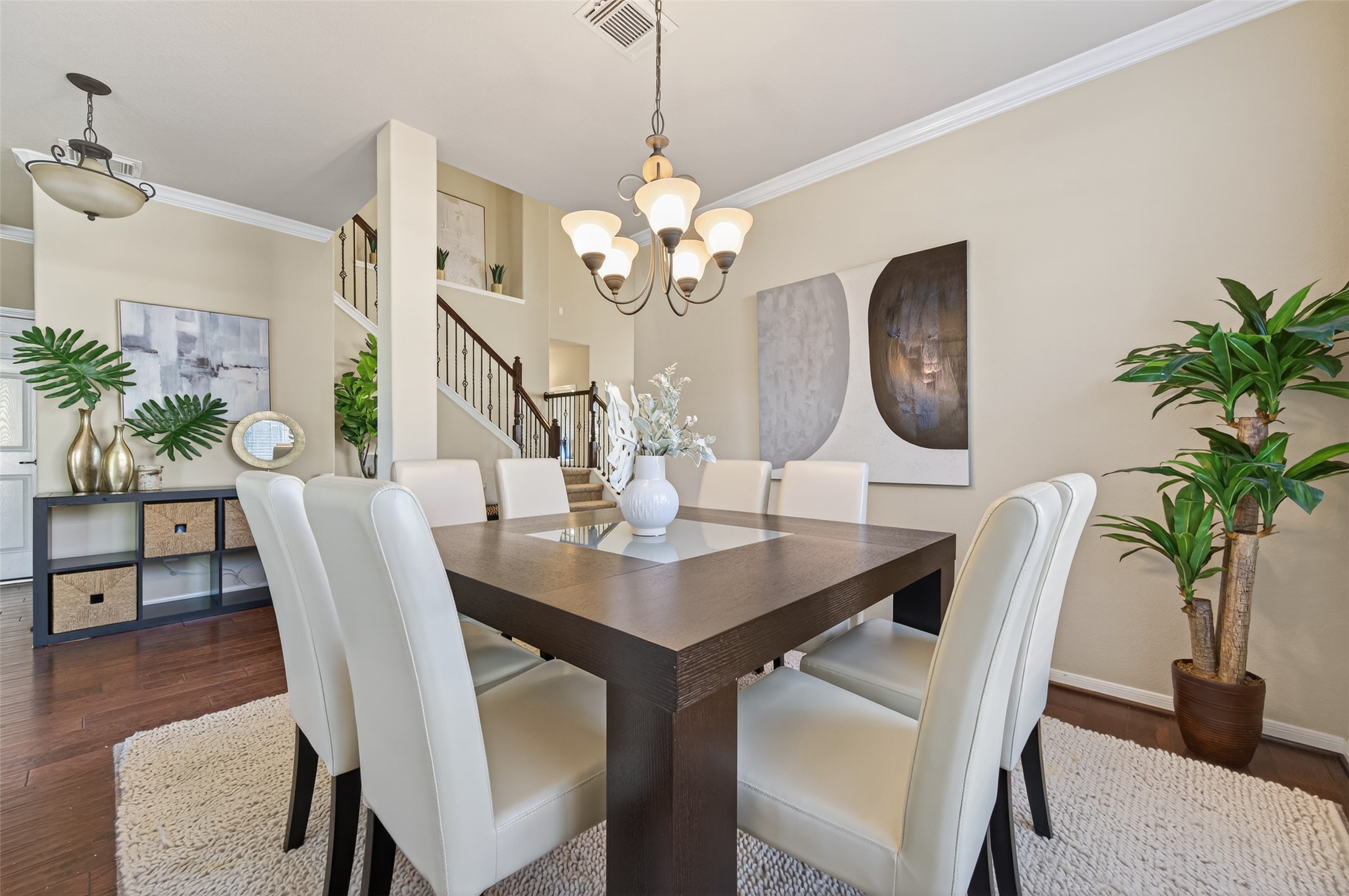 155 Rocky Point Drive Spring, TX 77389 - Photo 13 of 28 a view of a dining room with furniture a potted plant and wooden floor