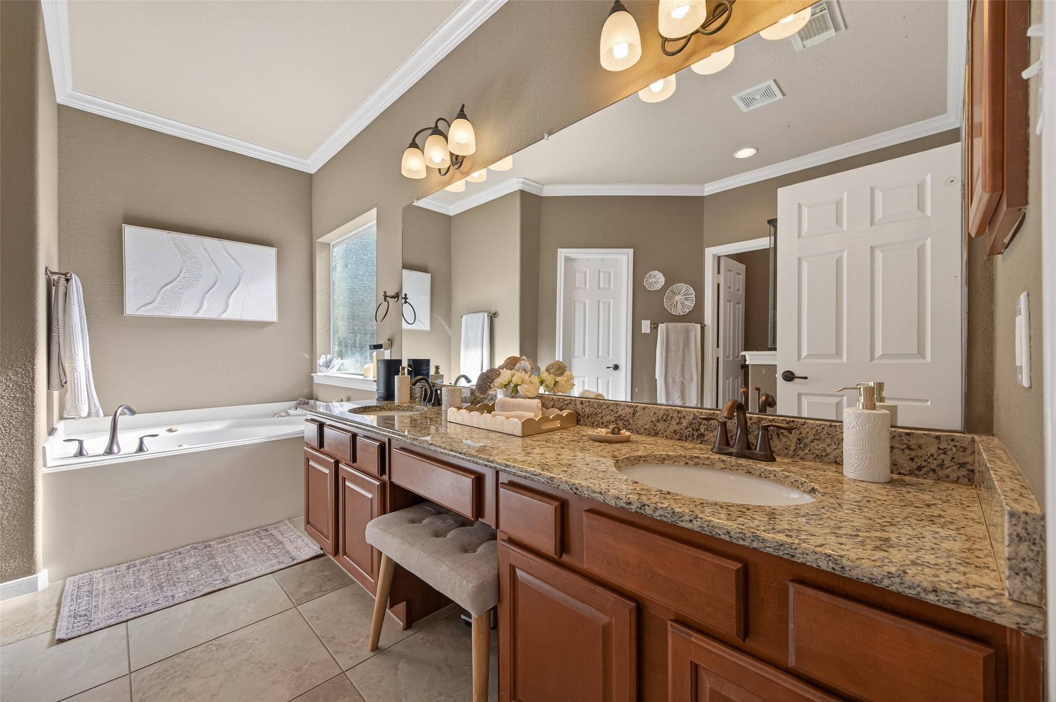 155 Rocky Point Drive Spring, TX 77389 - Photo 18 of 28 a bathroom with a granite countertop sink a large mirror and a bathtub