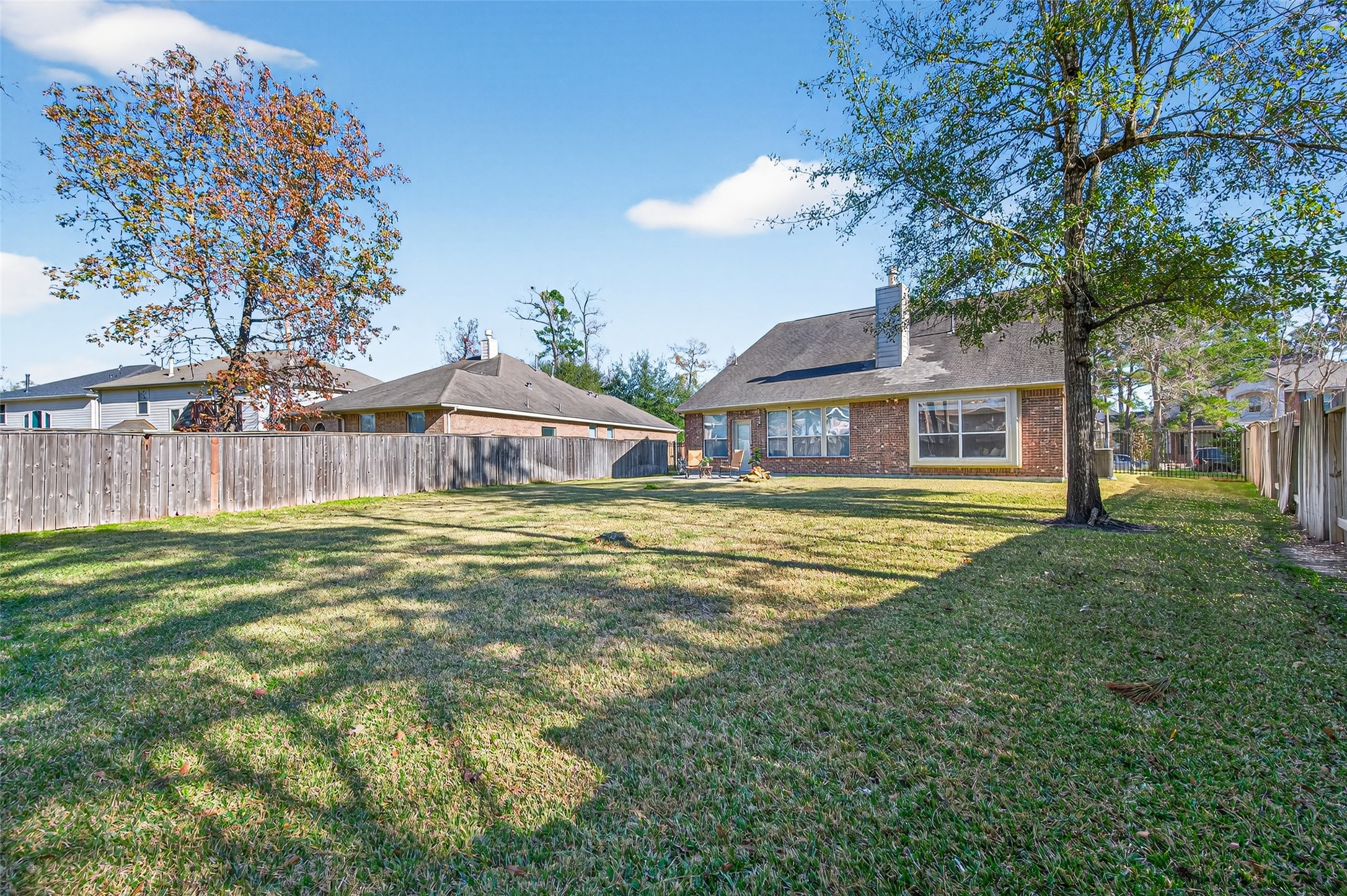 155 Rocky Point Drive Spring, TX 77389 - Photo 25 of 28 a front view of a house with a garden