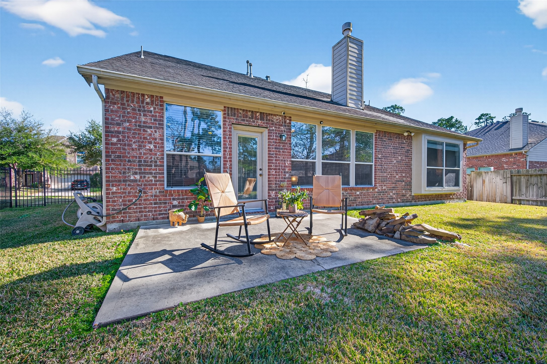 155 Rocky Point Drive Spring, TX 77389 - Photo 27 of 28 a view of a house with backyard sitting area and swimming pool