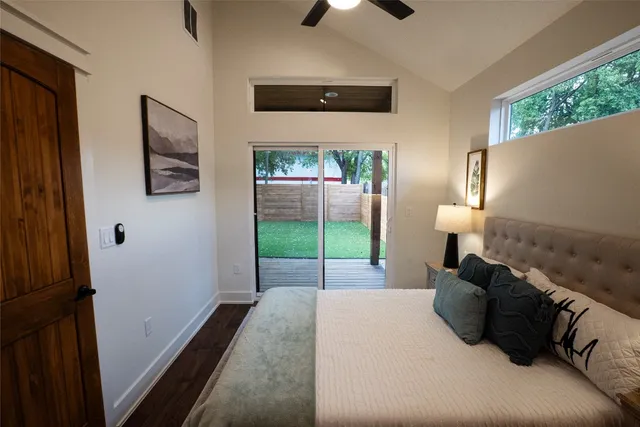 a bed room with a bed and a television