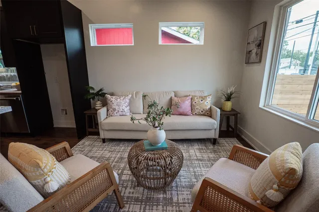 a living room with furniture and a window