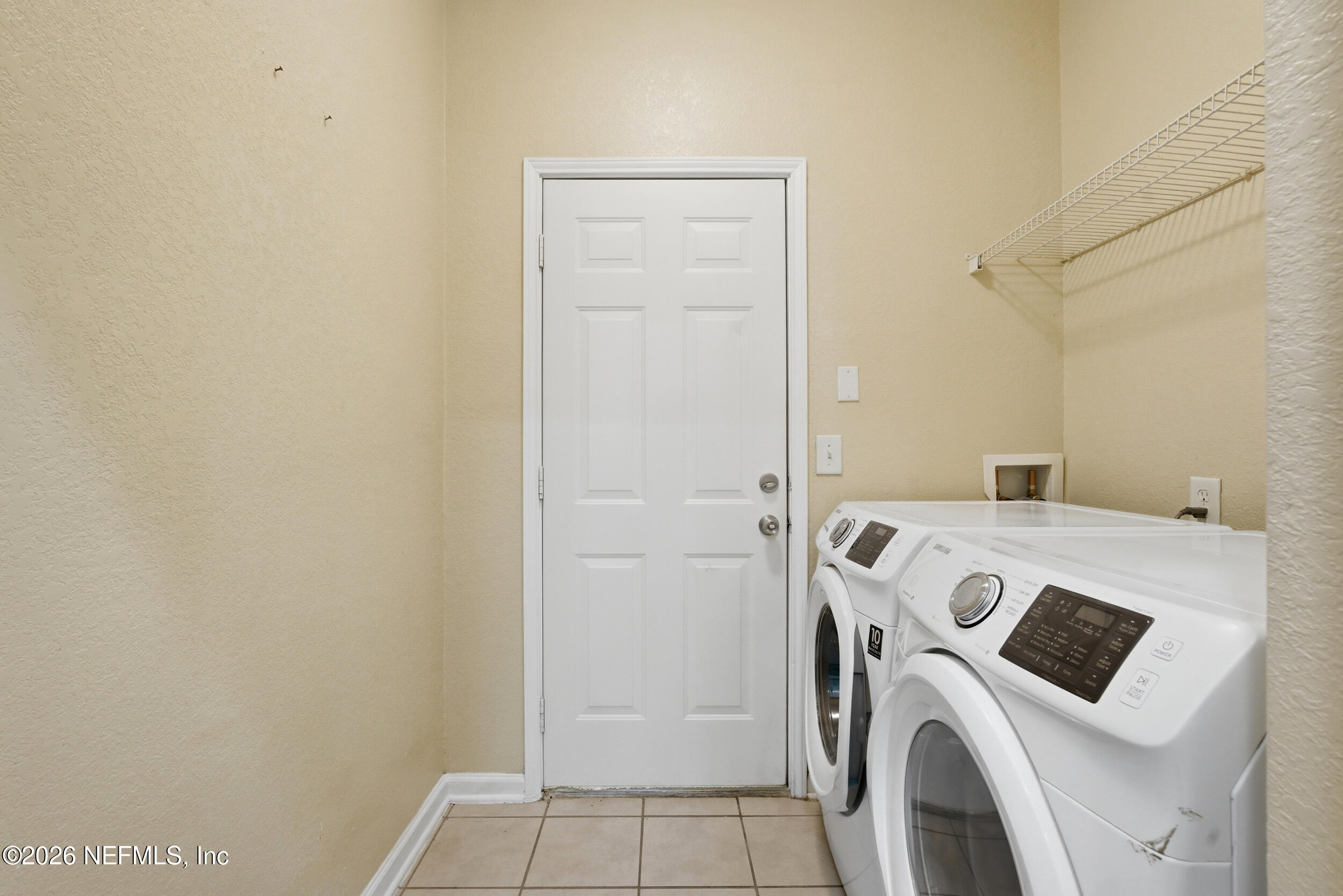 10200 Belle Rive Boulevard, Unit 4608 Jacksonville, FL 32256 - Photo 30 of 55 a utility room with dryer and washer