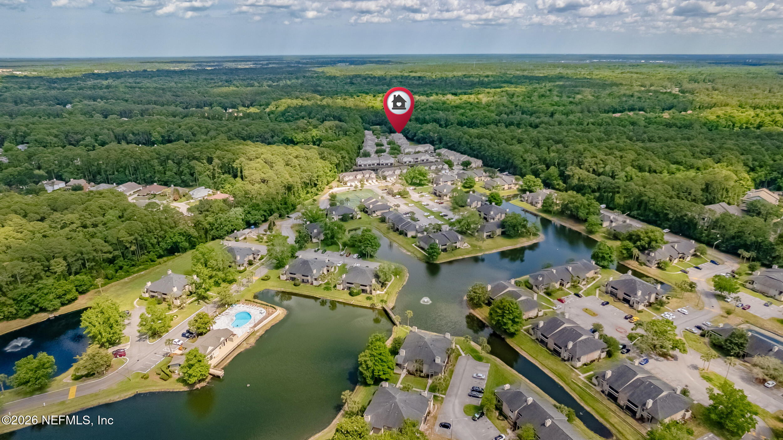 10200 Belle Rive Boulevard, Unit 4608 Jacksonville, FL 32256 - Photo 47 of 55 an aerial view of a house with a yard and lake view