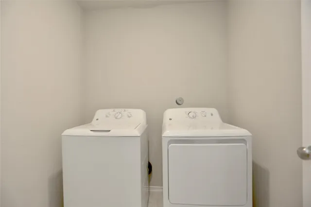 a utility room with dryer and washer