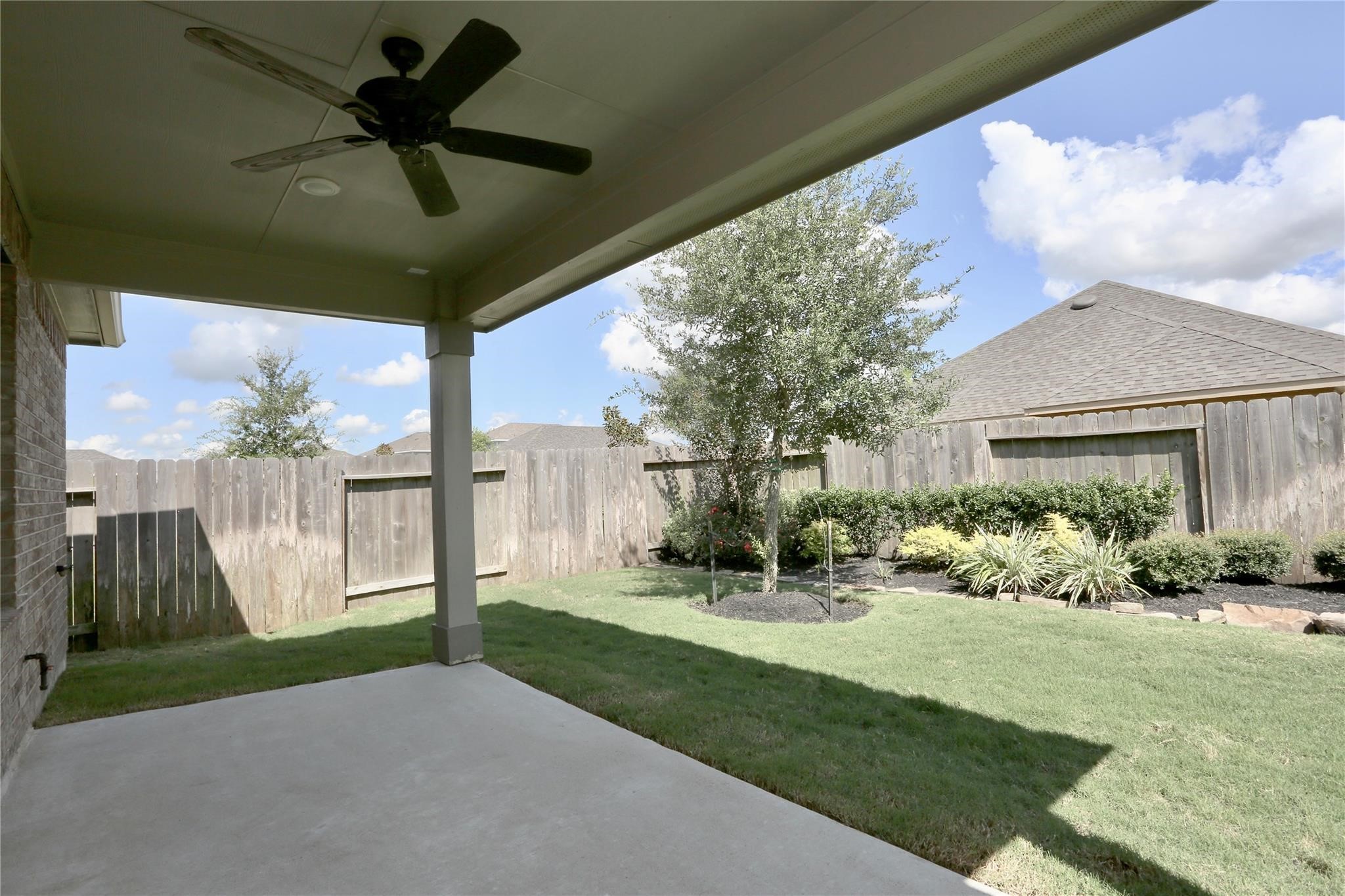 2123 Santa Ana Way Baytown, TX 77523 - Photo 19 of 20 a view of a porch with a garden