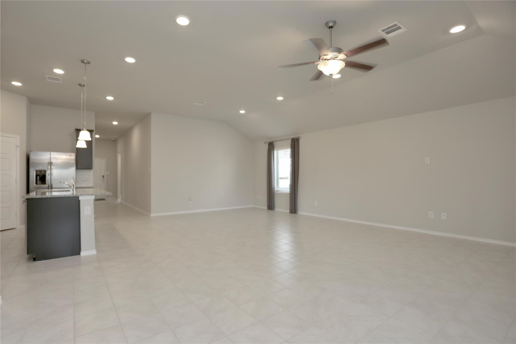 2123 Santa Ana Way Baytown, TX 77523 - Photo 8 of 20 a view of an empty room with a kitchen
