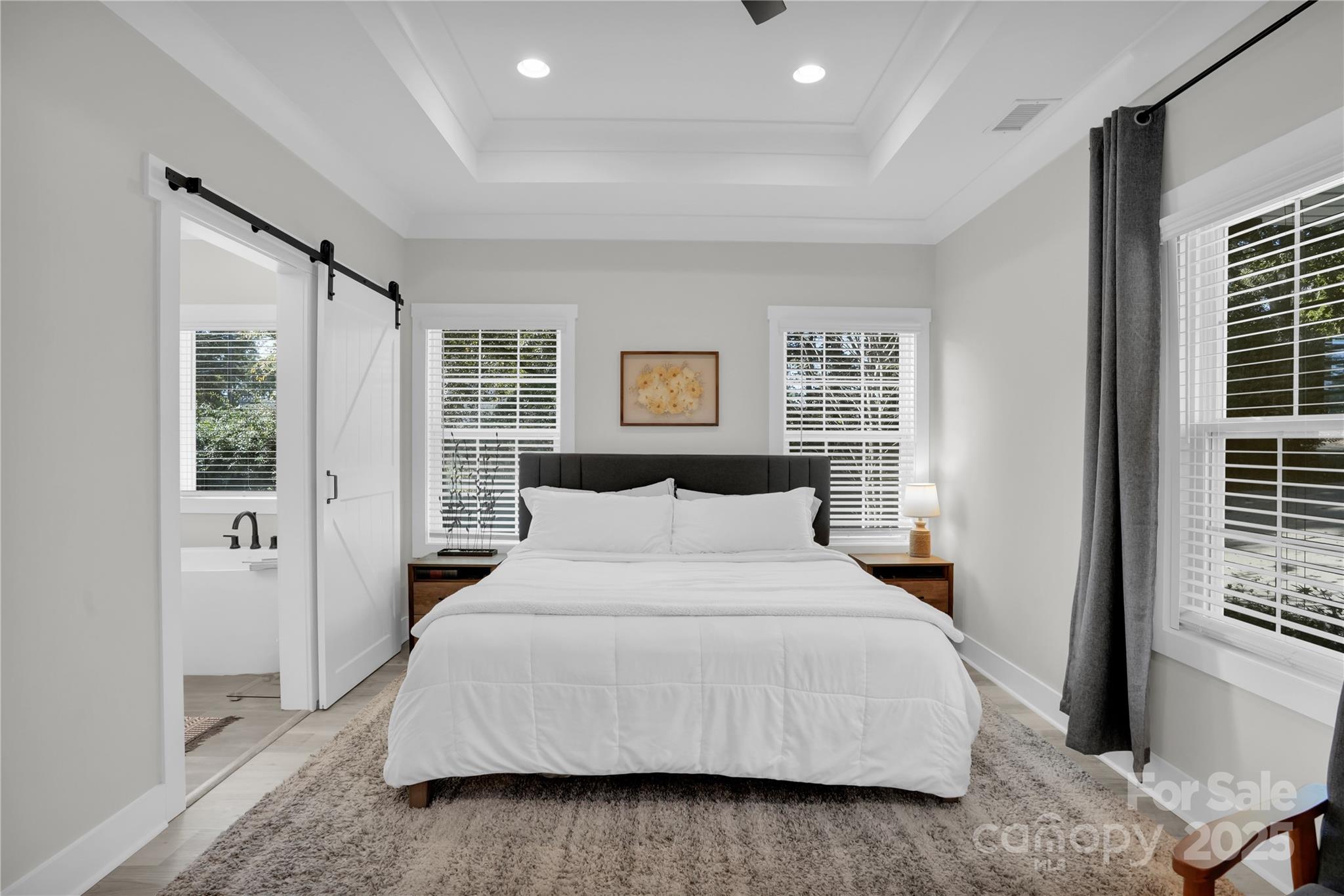 203 A Todd Street Belmont, NC 28012 - Photo 13 of 30 a bedroom with a large bed and a window