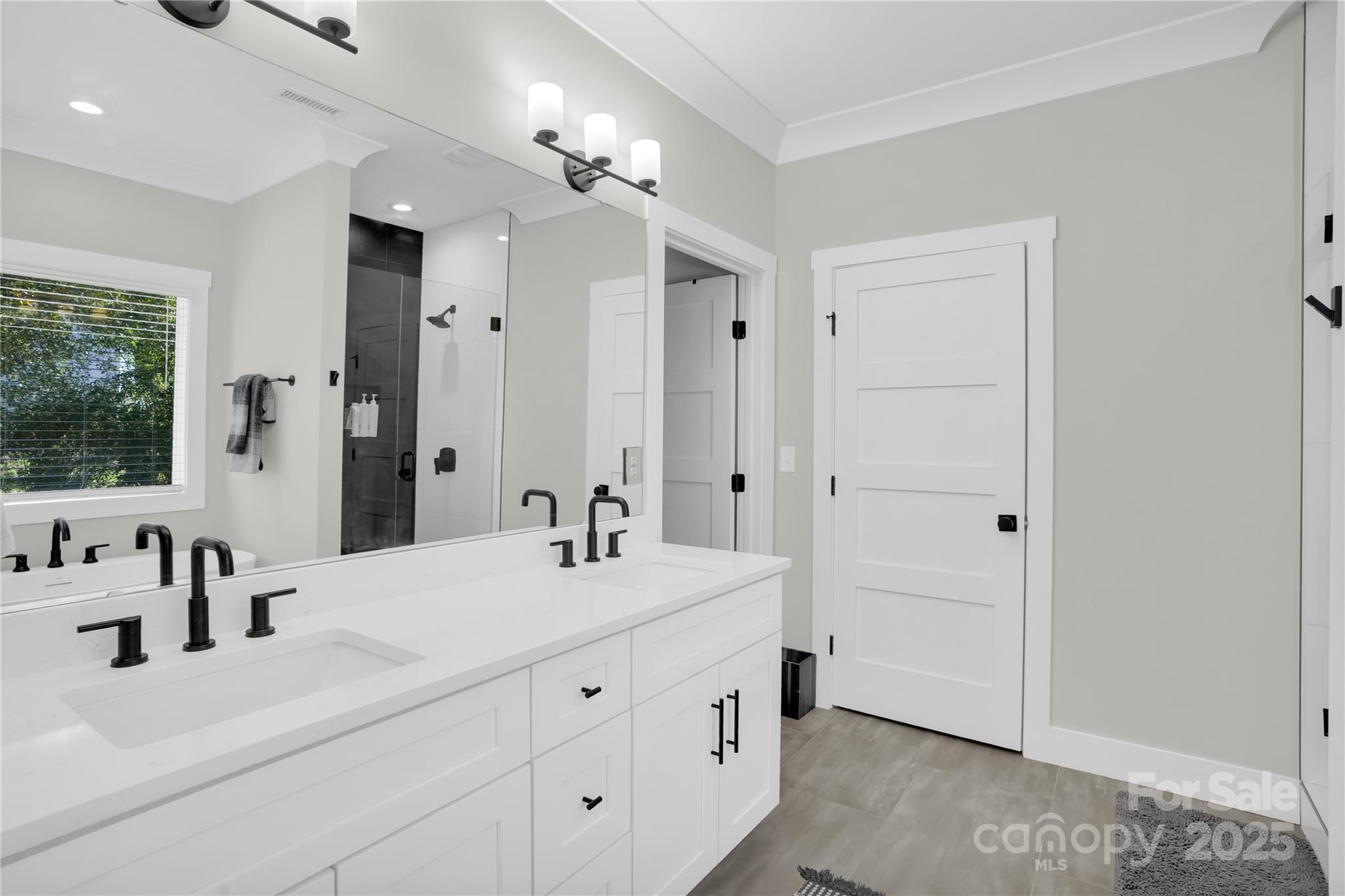 203 A Todd Street Belmont, NC 28012 - Photo 14 of 30 a bathroom with a double vanity sink a mirror and a shower