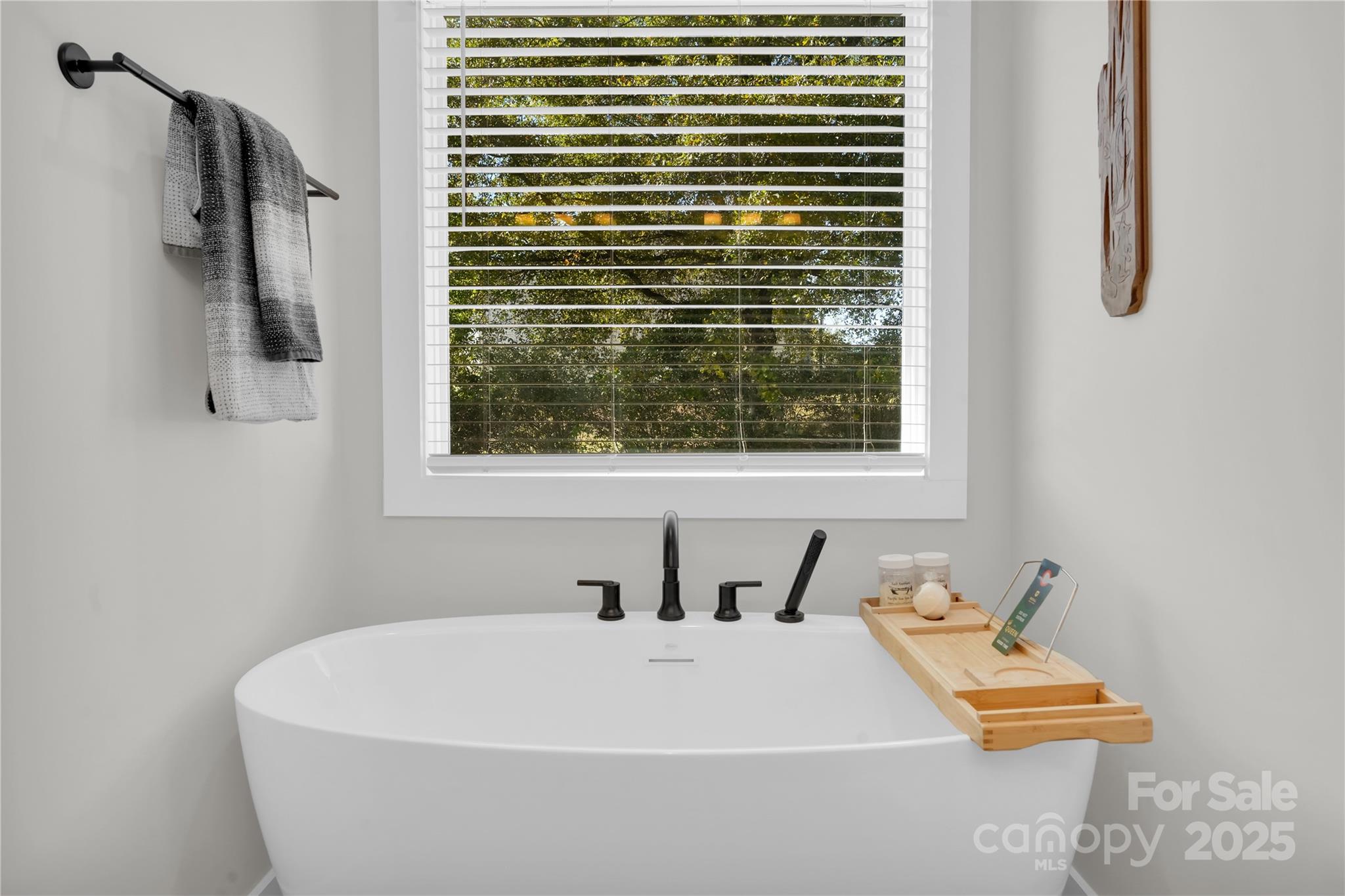 203 A Todd Street Belmont, NC 28012 - Photo 17 of 30 a bathroom with a bathtub and a window