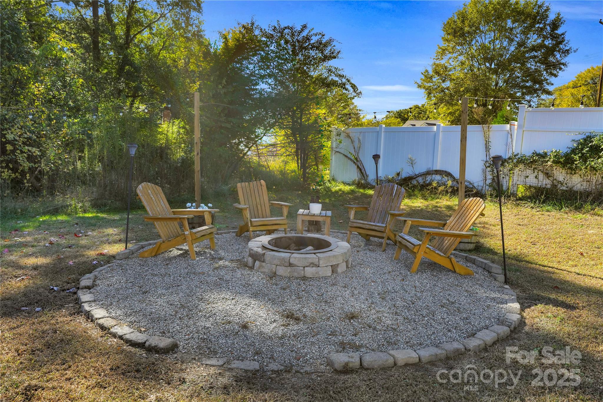 203 A Todd Street Belmont, NC 28012 - Photo 25 of 30 a backyard of a house with table and chairs