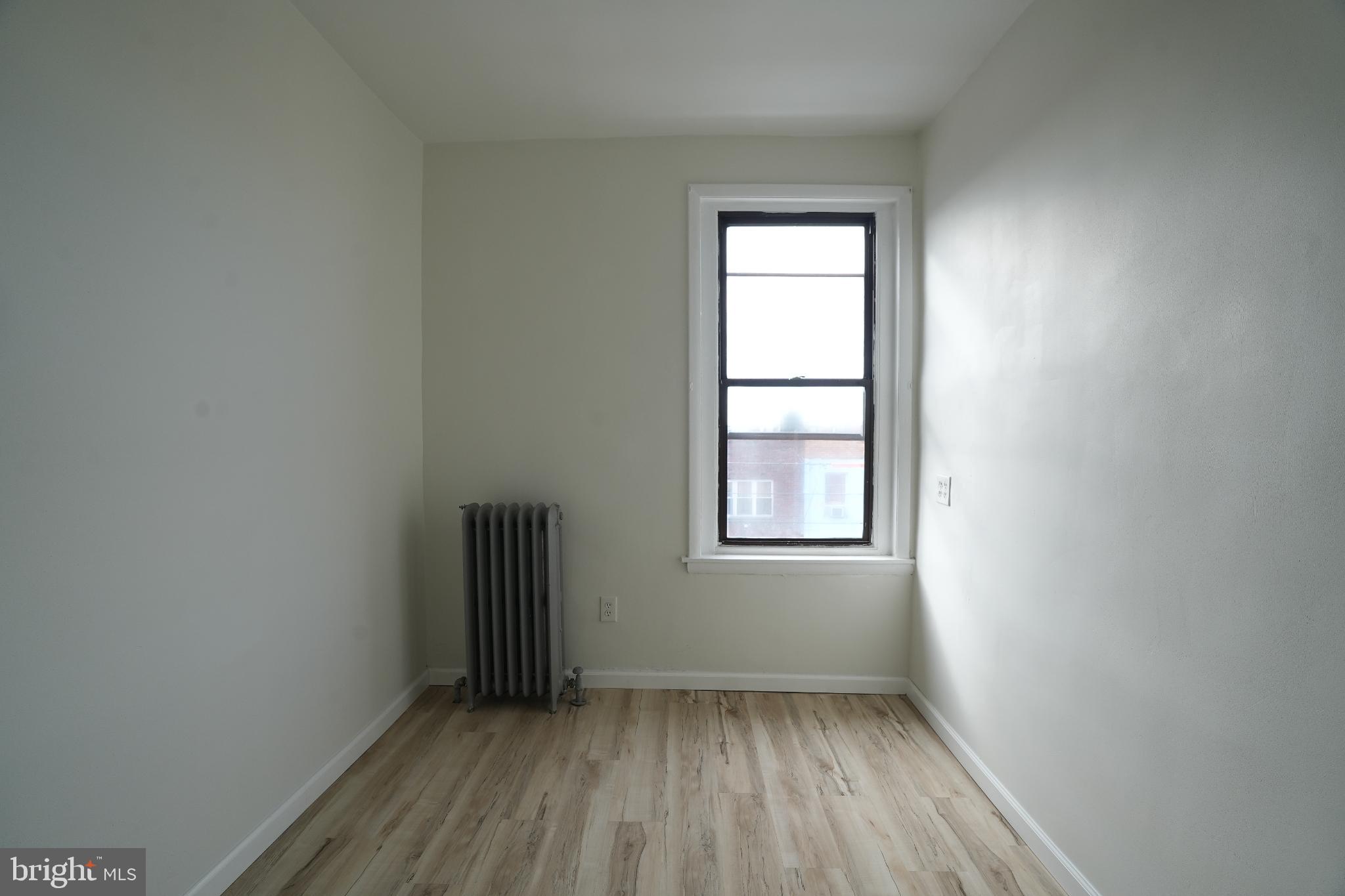 2252 South Hicks Street, Unit 3 Philadelphia, PA 19145 - Photo 6 of 6 an empty room with a window