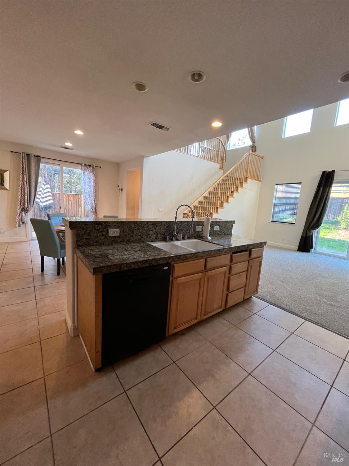 2472 Shorey Way Fairfield, CA 94533 - Photo 12 of 43 a kitchen with stainless steel appliances granite countertop a sink and a stove