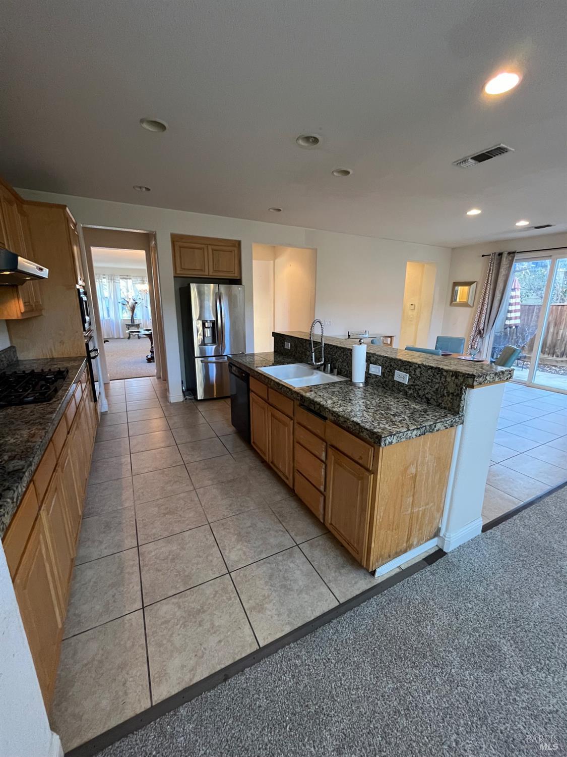 2472 Shorey Way Fairfield, CA 94533 - Photo 13 of 43 a large kitchen with a stove a sink a counter space and cabinets