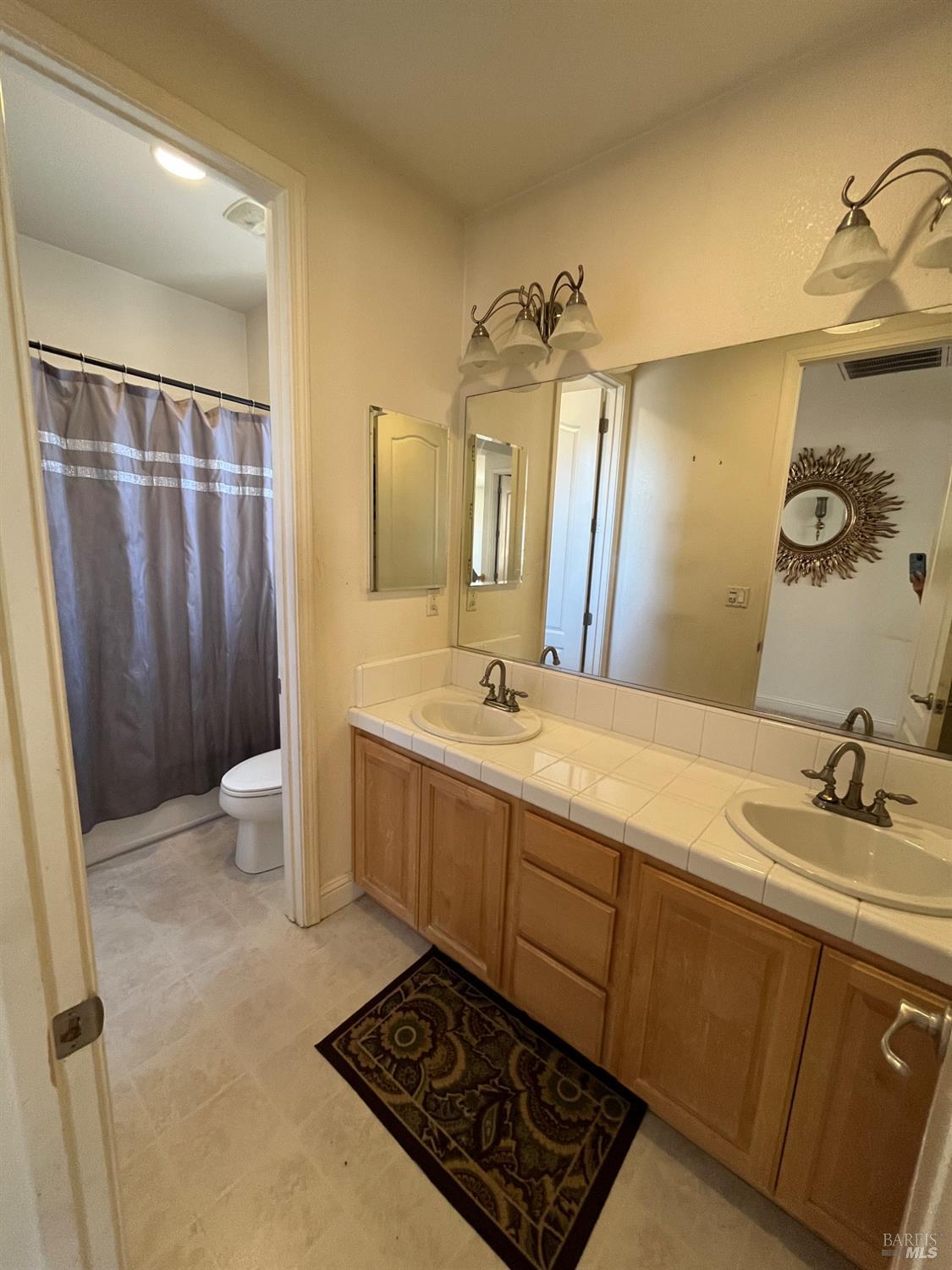 2472 Shorey Way Fairfield, CA 94533 - Photo 28 of 43 a bathroom with a sink toilet and shower
