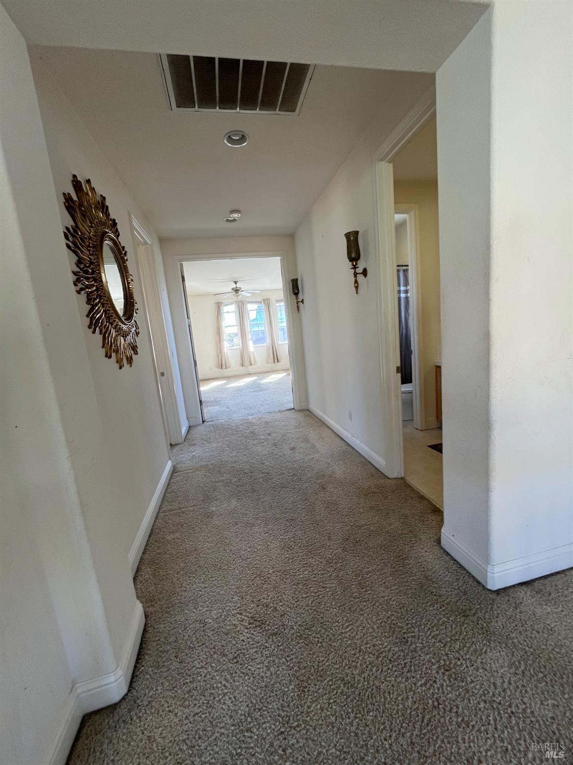 2472 Shorey Way Fairfield, CA 94533 - Photo 29 of 43 a view of a big room with windows and chandelier fan