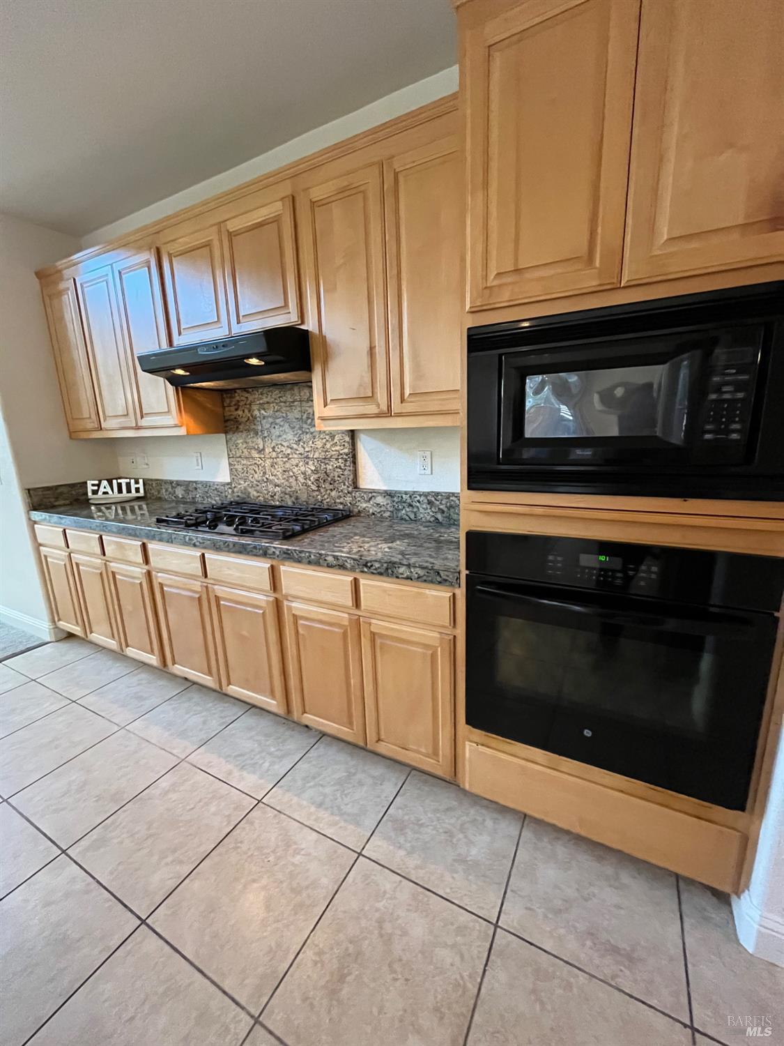 2472 Shorey Way Fairfield, CA 94533 - Photo 8 of 43 a kitchen with granite countertop a stove a sink and cabinets