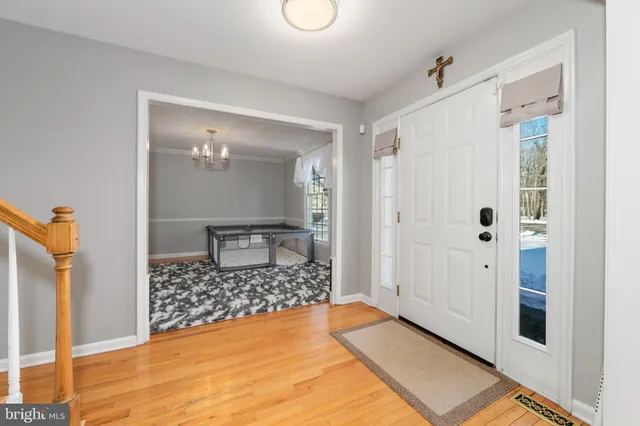a view of livingroom with walk in closet and wooden floor
