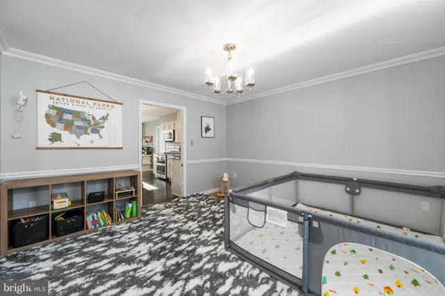 a bedroom with bed and wooden floor