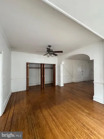 a view of a livingroom with wooden floor