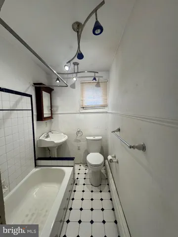 a bathroom with a sink and a shower