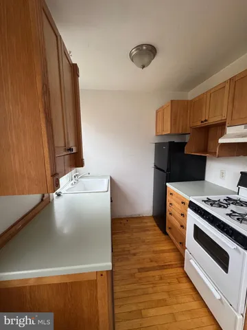 a view of a sink in a room next to a window