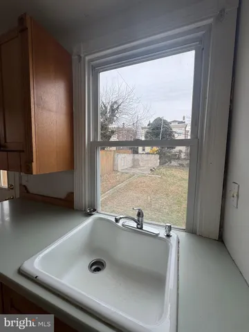 a view of a swimming pool with a yard