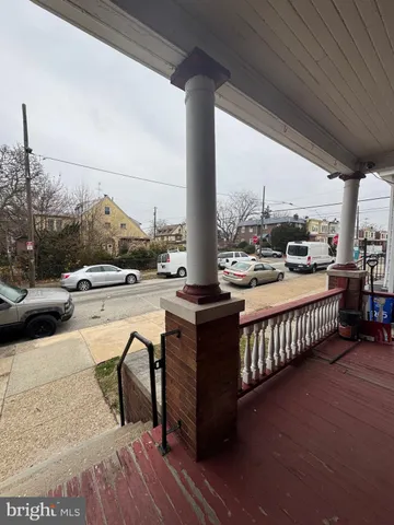 a view of balcony with couch and chairs