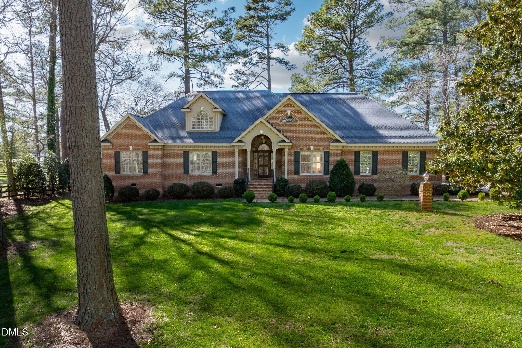 4076 Salem Farm Road Oxford, NC 27565 - Photo 55 of 55 a front view of a house with a garden and plants