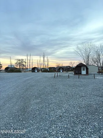 a view of a big yard with an outdoor seating