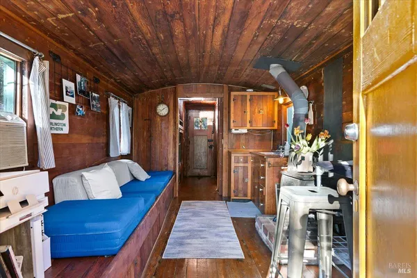 a outdoor space with lots of furniture and wooden floor