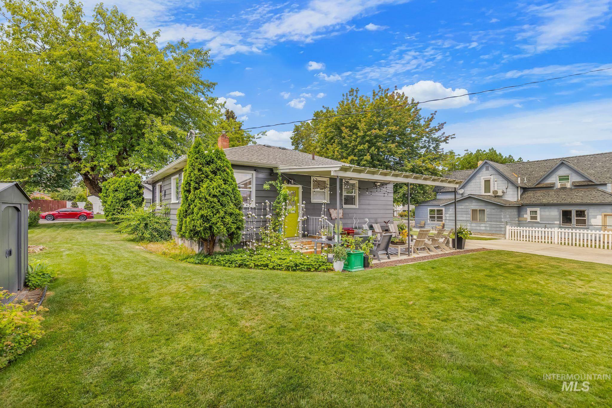 1315 8th Street Clarkston, WA 99403 - Photo 36 of 37 Expansive backyard featuring a manicured lawn and mature trees