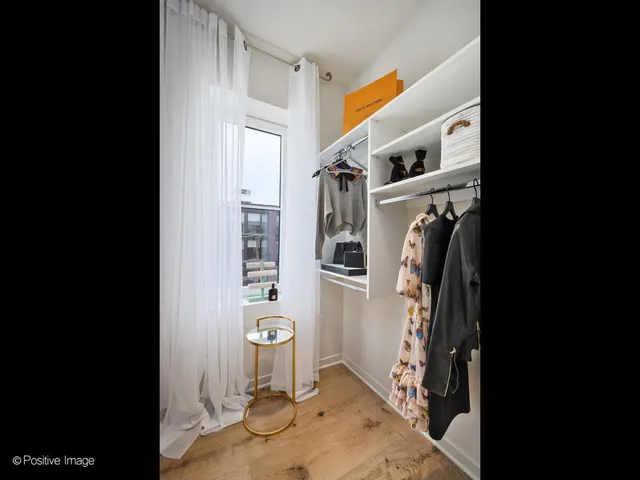 a view of a kitchen with a refrigerator and window