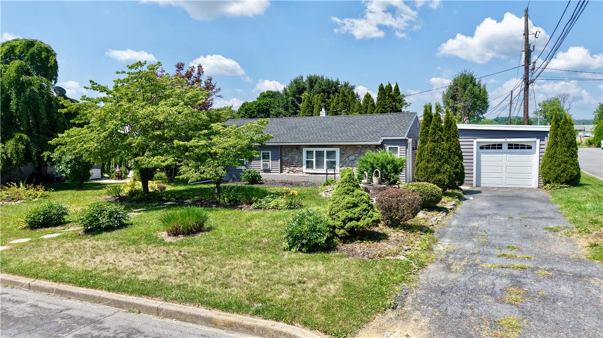 246 Poplar Street Bath, PA 18014 - Photo 2 of 34 Mature trees and neat landscaping frame this inviting home with an attached garage.